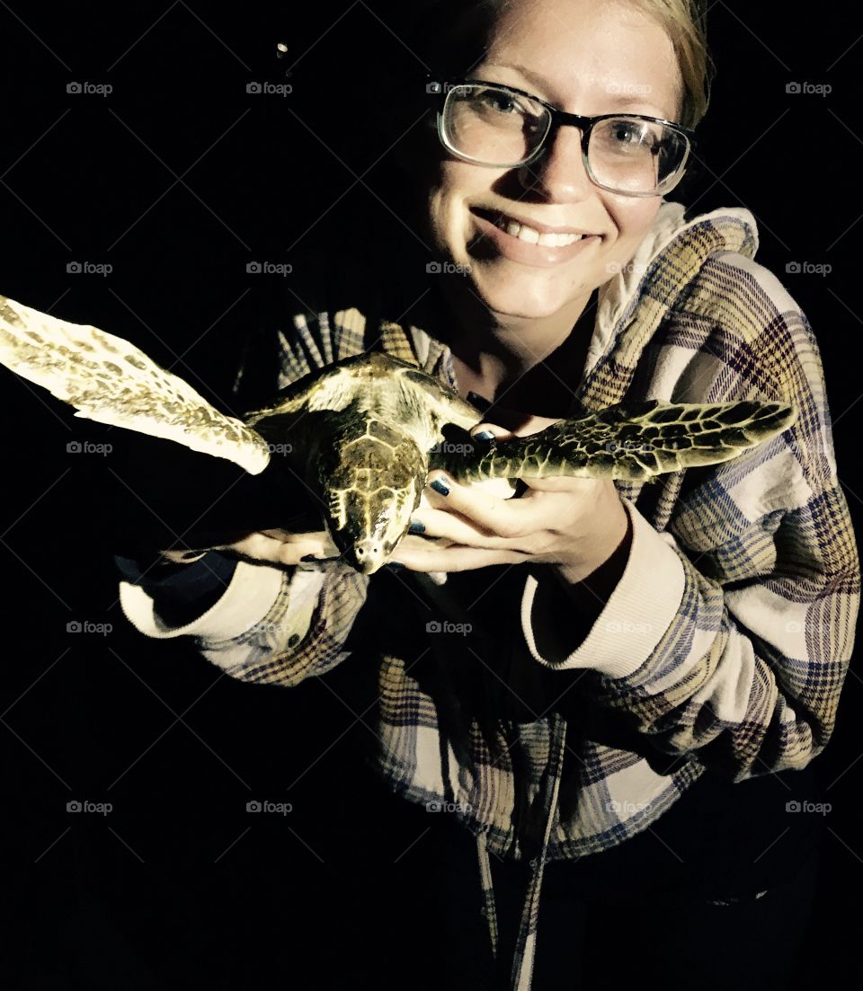 Girl holding turtle 