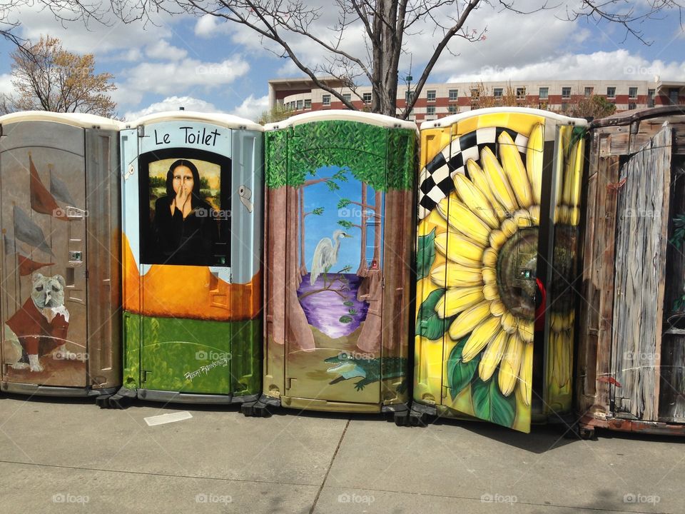 Portable toilets with murals