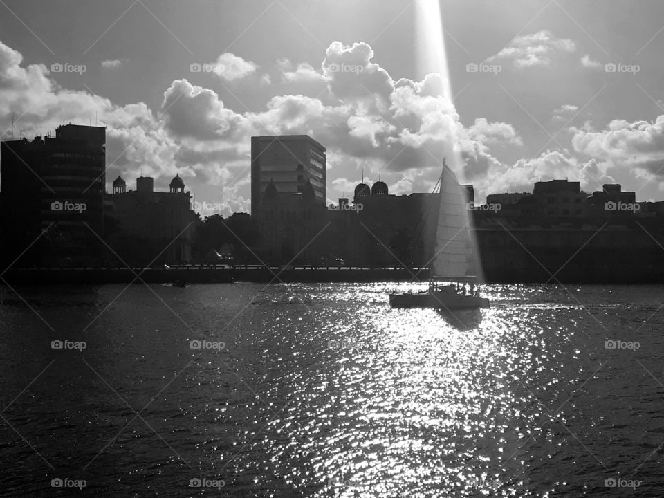 Partial view of Recife. Solar ray hits a boat at the time of the photo.