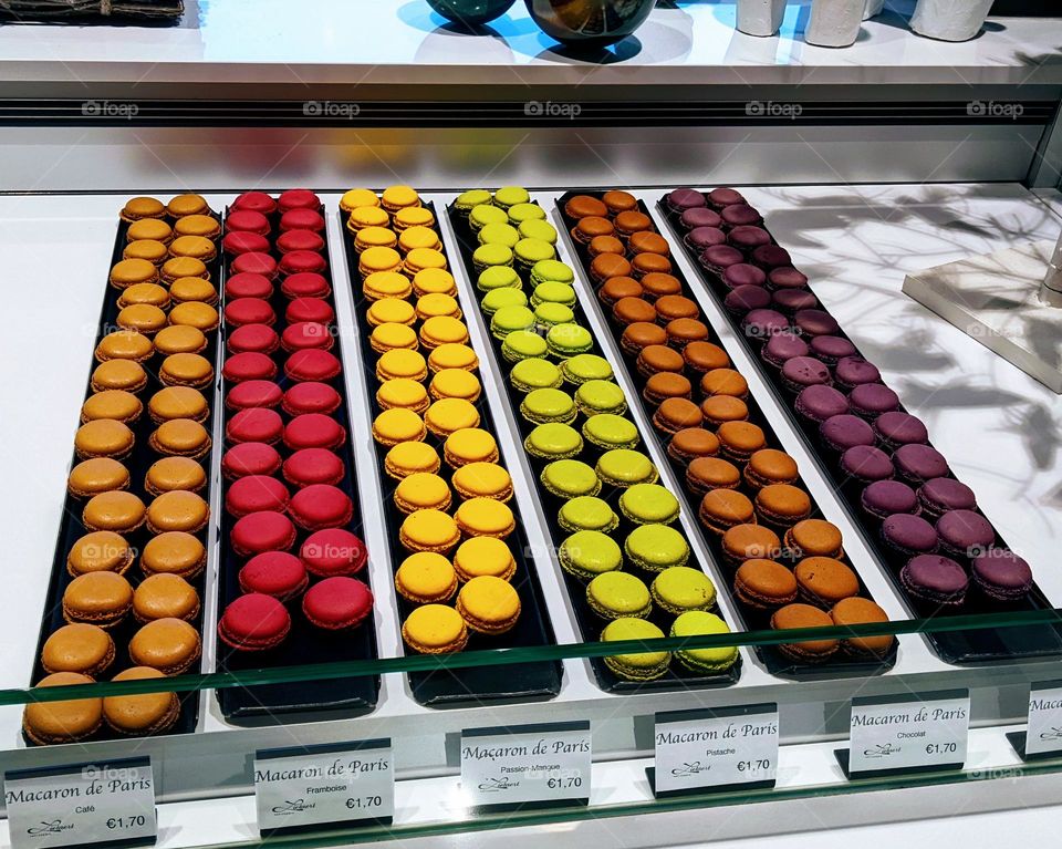 macrons in diffferent colours, Brown, red, yellow, green, purple. foodies.