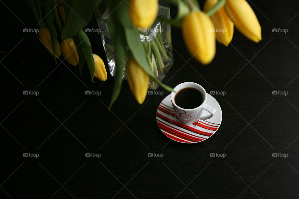 Black coffee and yellow tulips. Good morning!