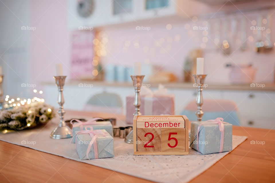 Christmas background with wooden block calendar with the date of December 25