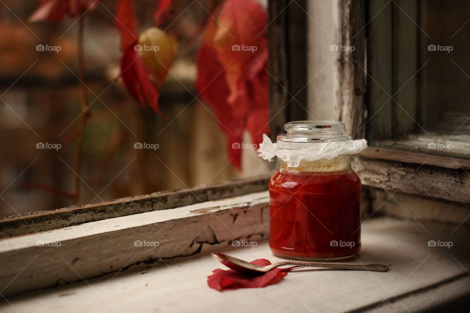 mother's rosehip jam on the windowsill in the fall