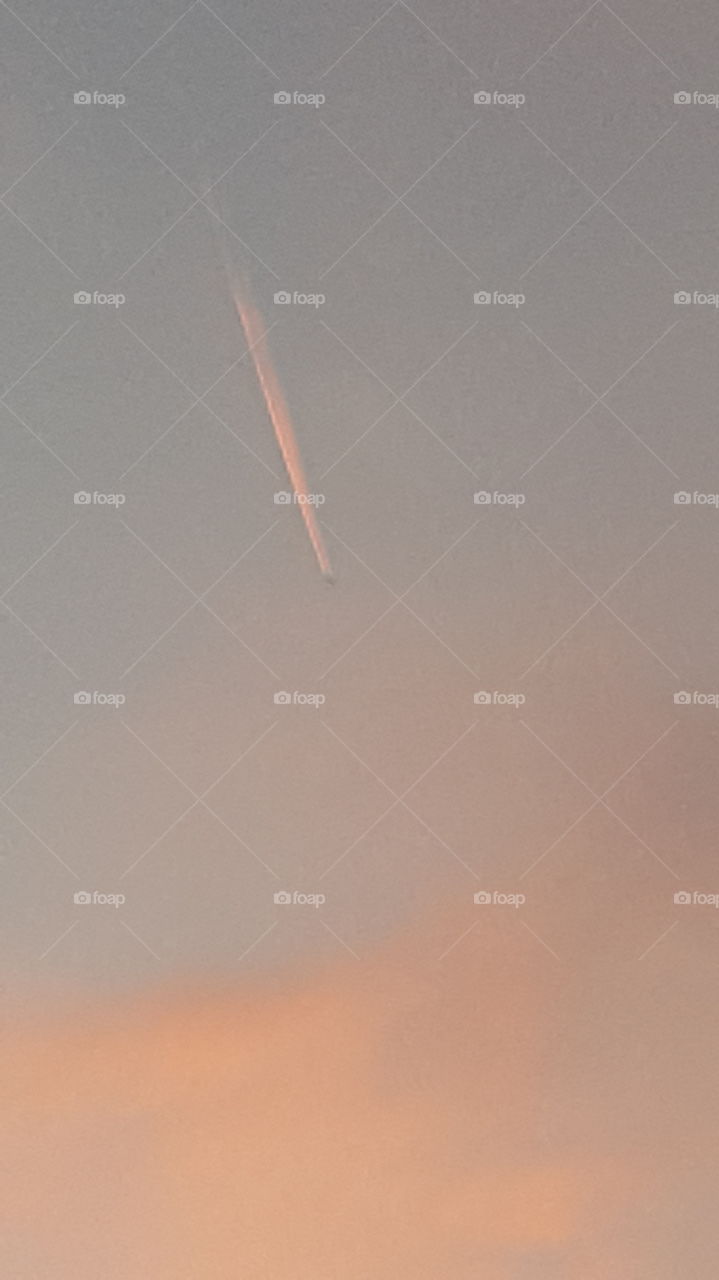 pink jet stream in sunset