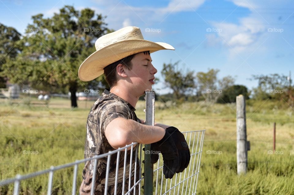 Teenage boy wearing cowboy hat