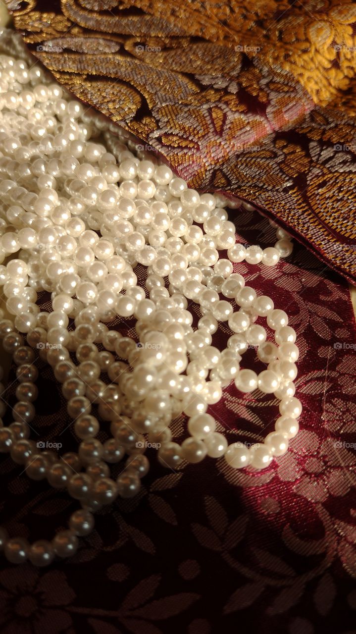 pearls soaking in sunrays
beads
bright  & sparkling