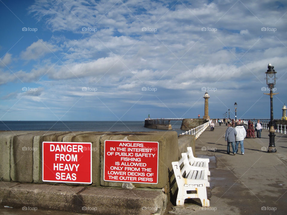 lighthouse whitby pier danger signs whitby uk by snappychappie