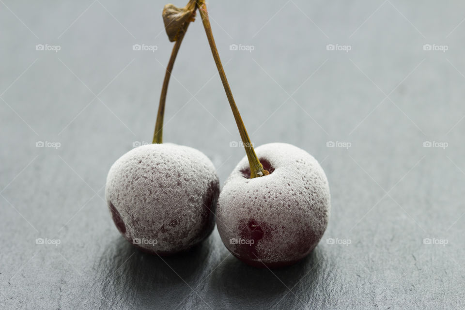 Group Of Frozen Cherries on a dark background Close Up