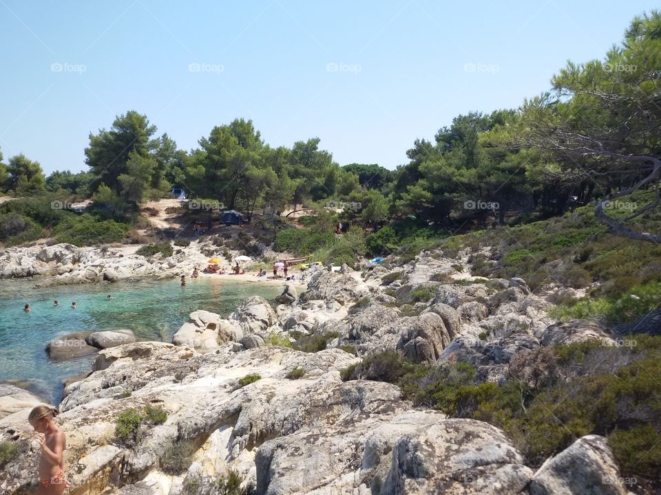 Orange beach Sithonia Greece. Stones and sand