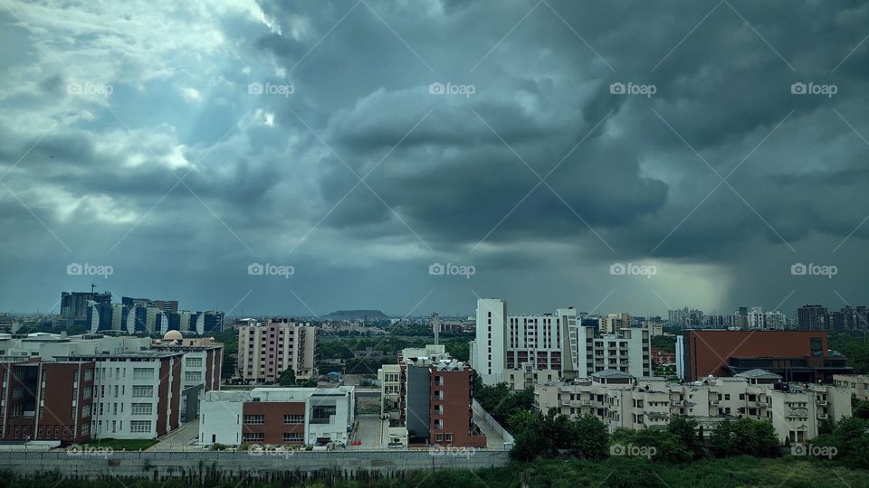 This is a rainy day in downtown with silver lining of the clouds. A perfect wallpaper for the lover of buildings and concrete nature 😎👍🏻