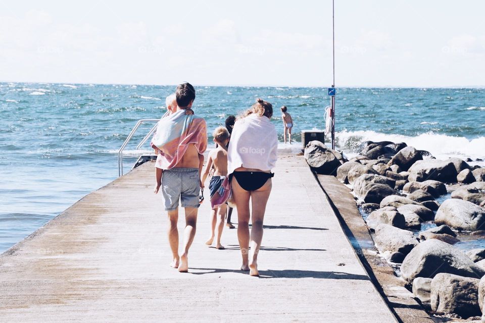 Family going to the beach on a beautiful day 