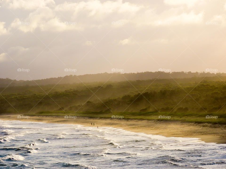 Misty coast sunset