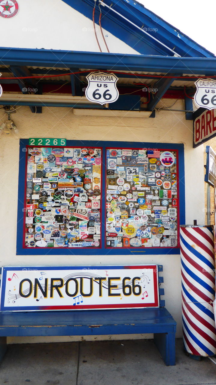 Window full of sign in an Barber house in the route 66