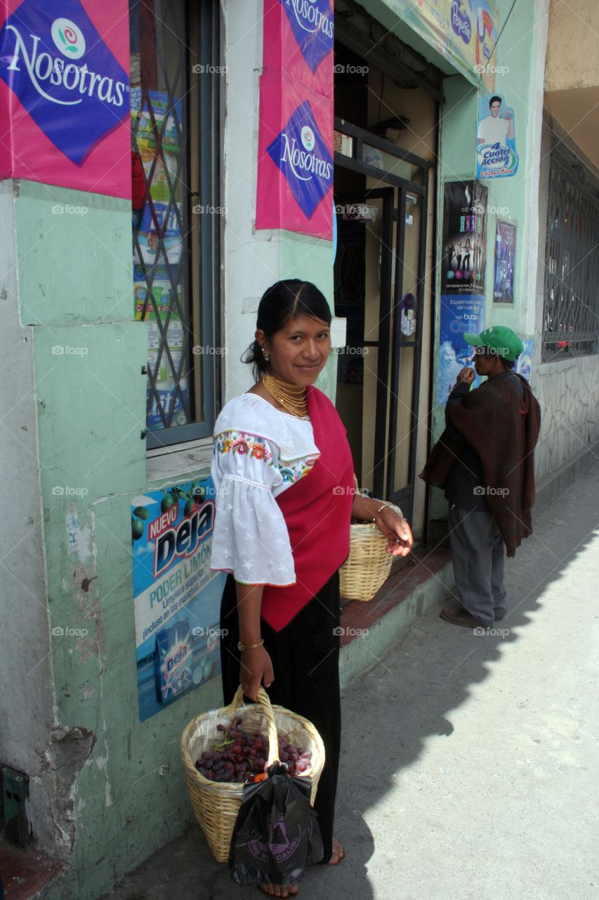 Indian woman selling strawberries in Riobamba Ecuador