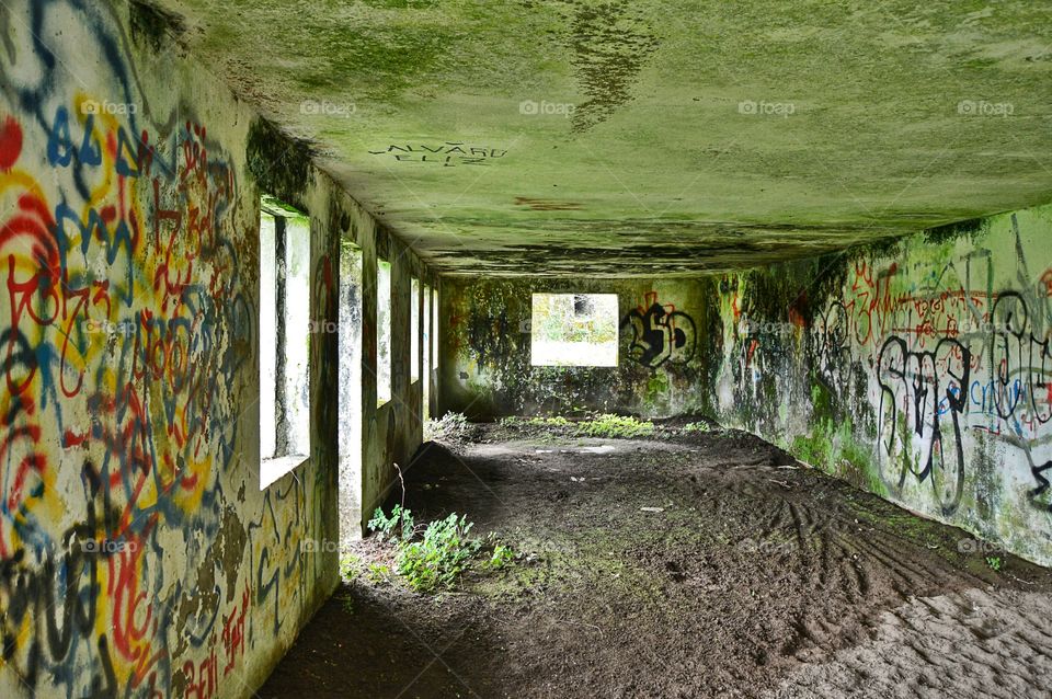 Graffitied old building. Graffiti on the walls of an old abandoned building