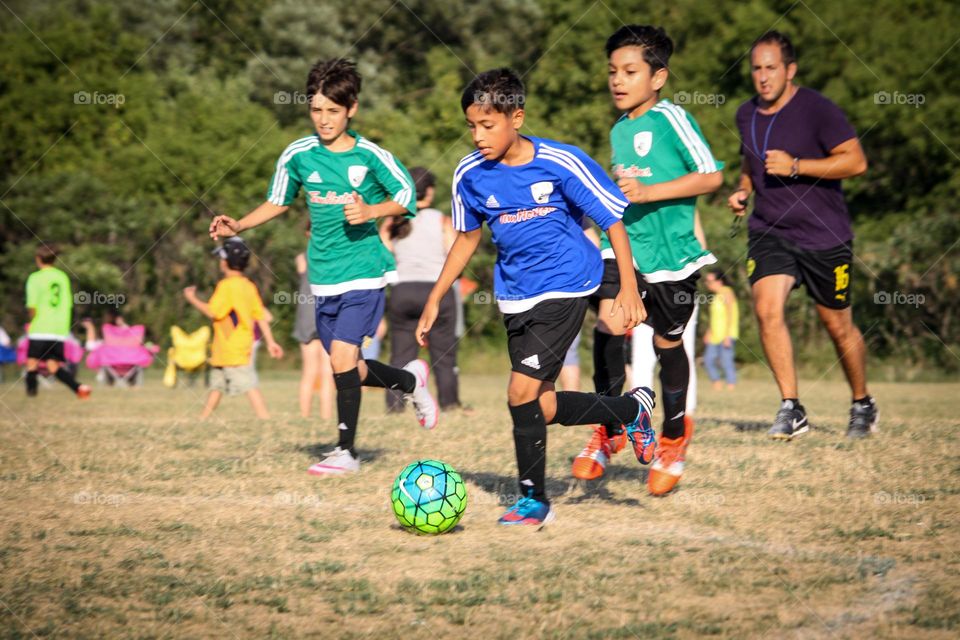 Kids are playing soccer