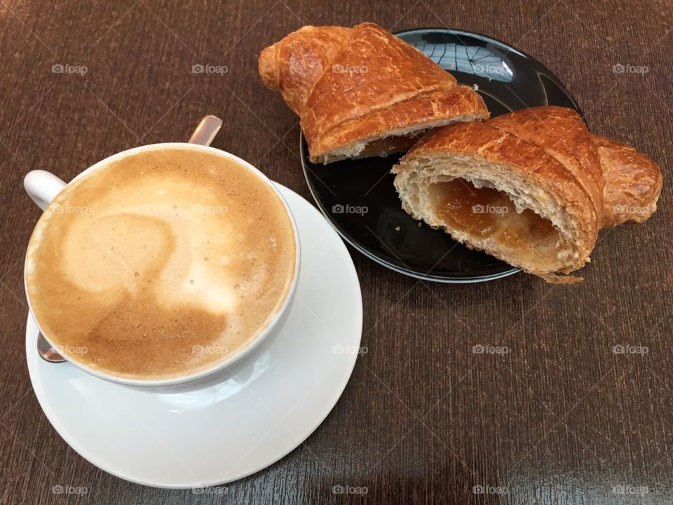 Soia cappuccino and croissant filled with honey