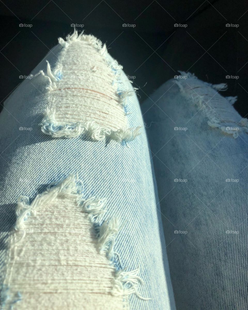 The feeling of blue distressed jeans. 