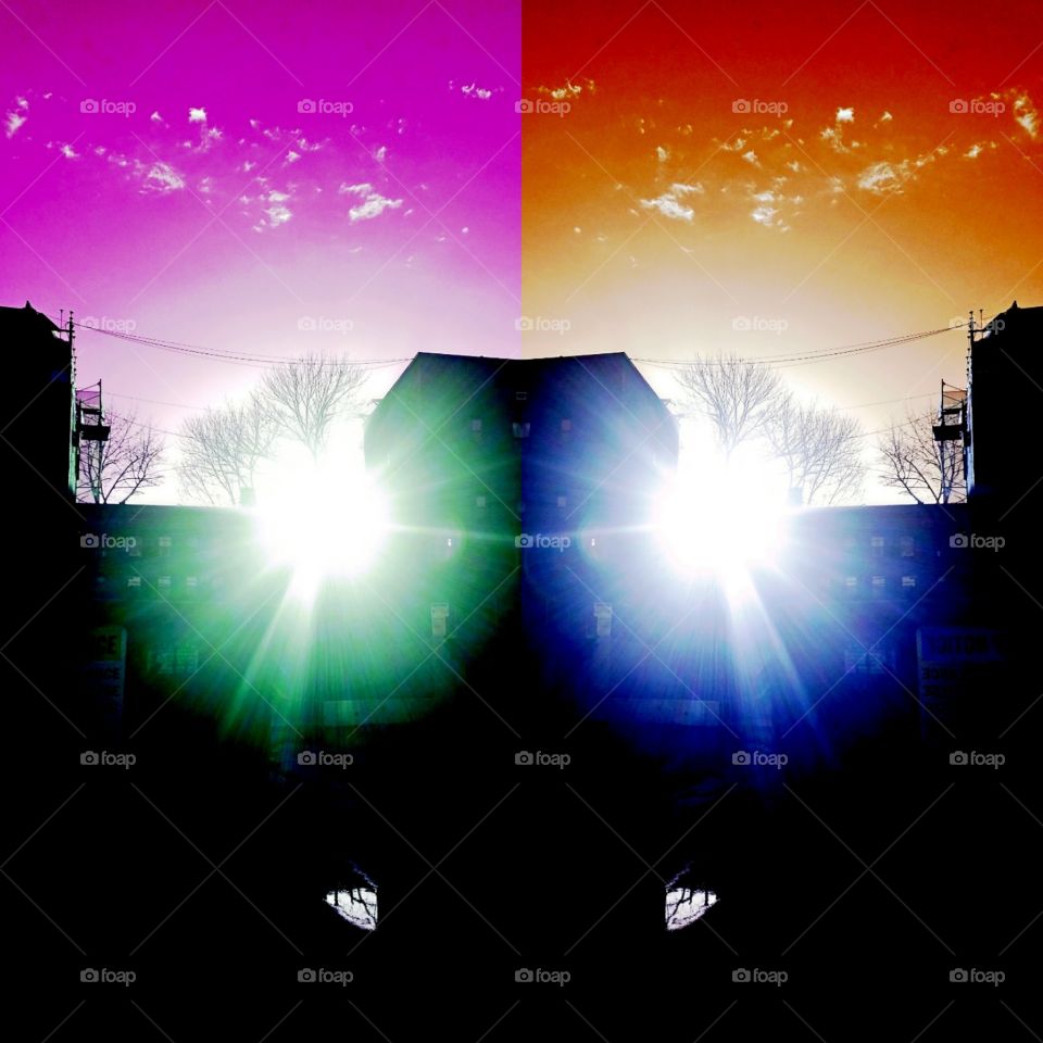 Sun glare peaking through the clouds after a rain storm in Bayside NY on a warm April evening