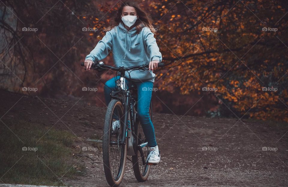 Girl is riding the bicycle in the park