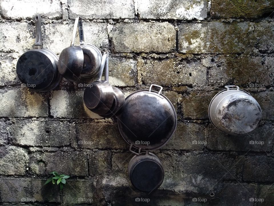 Kitchen utensils hanged on wall