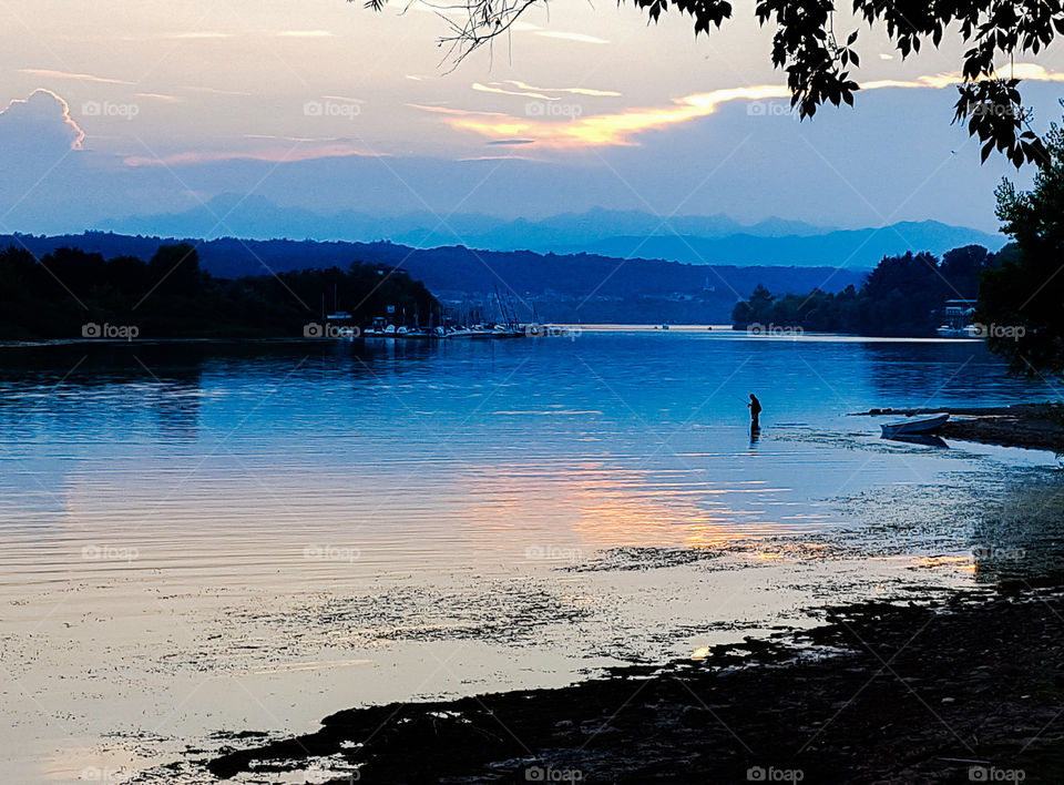 Fisherman in Lake Maggiore in Italy