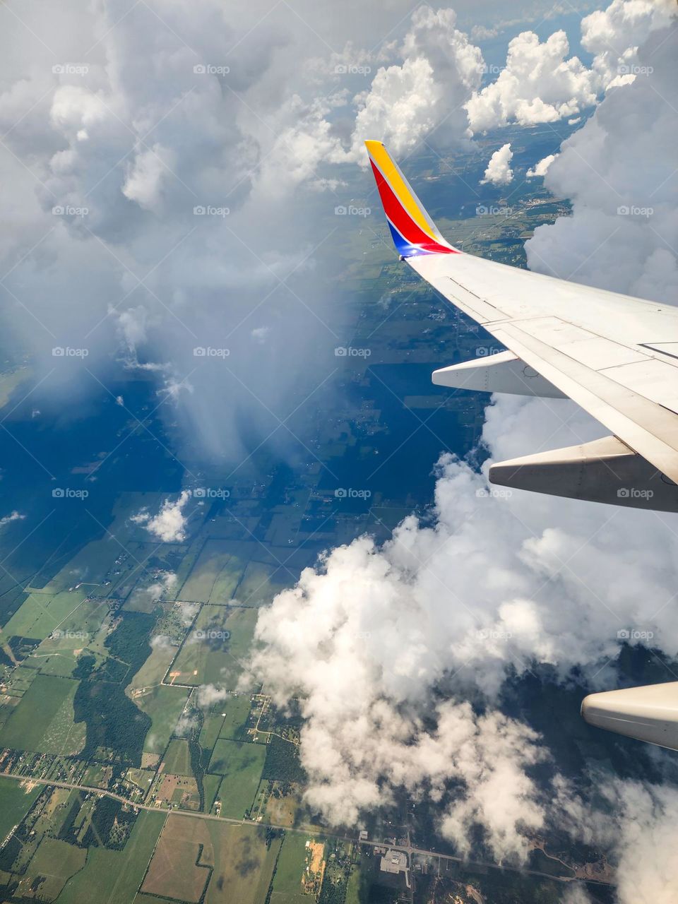 Heavy rain falls from a large dark cloud over the Texas plains near Houston