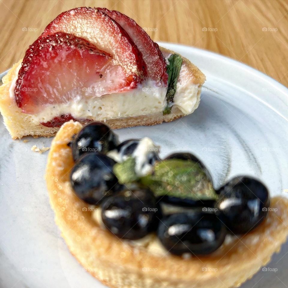 Homemade yummy colourful fruit tarts in berries 