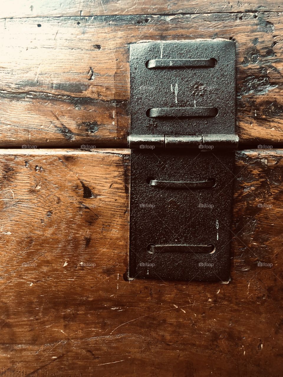 Metal hinge on an antique wooden chest