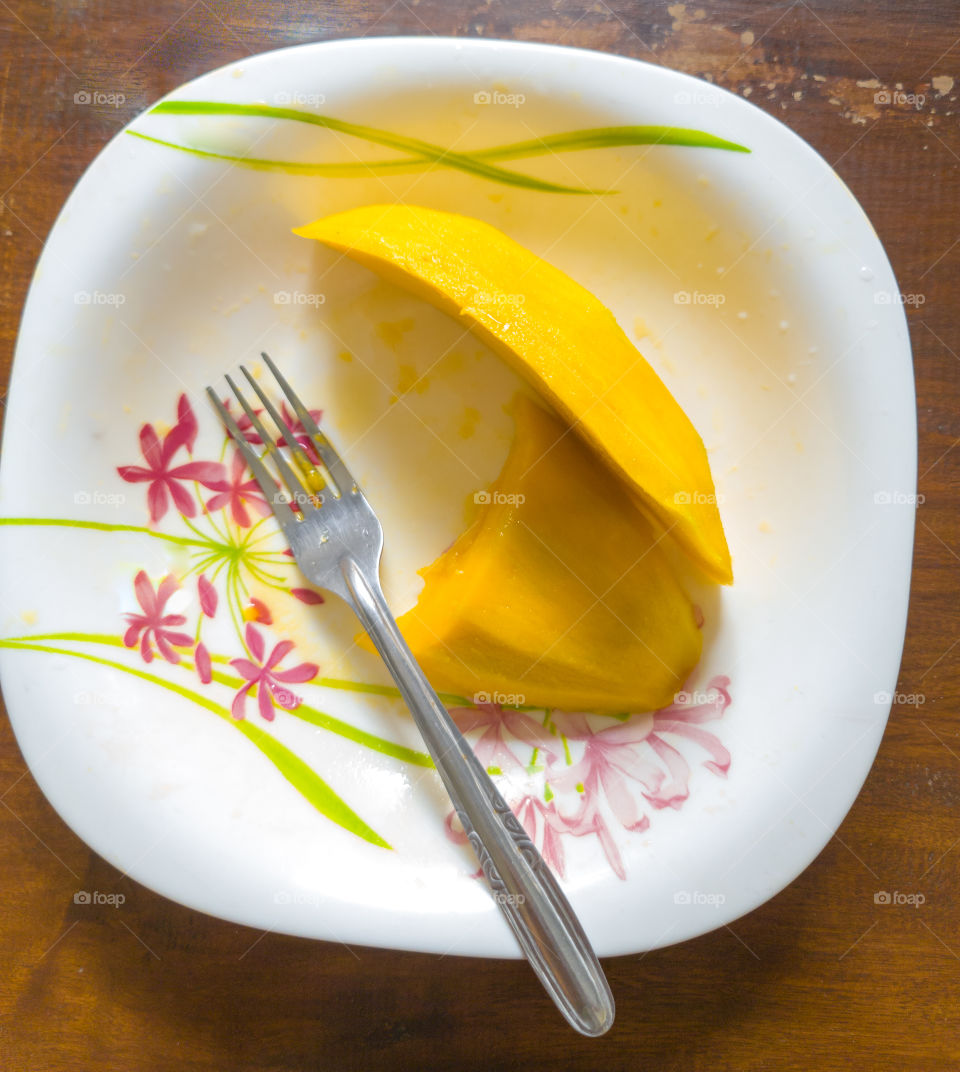 Mango on painted plate