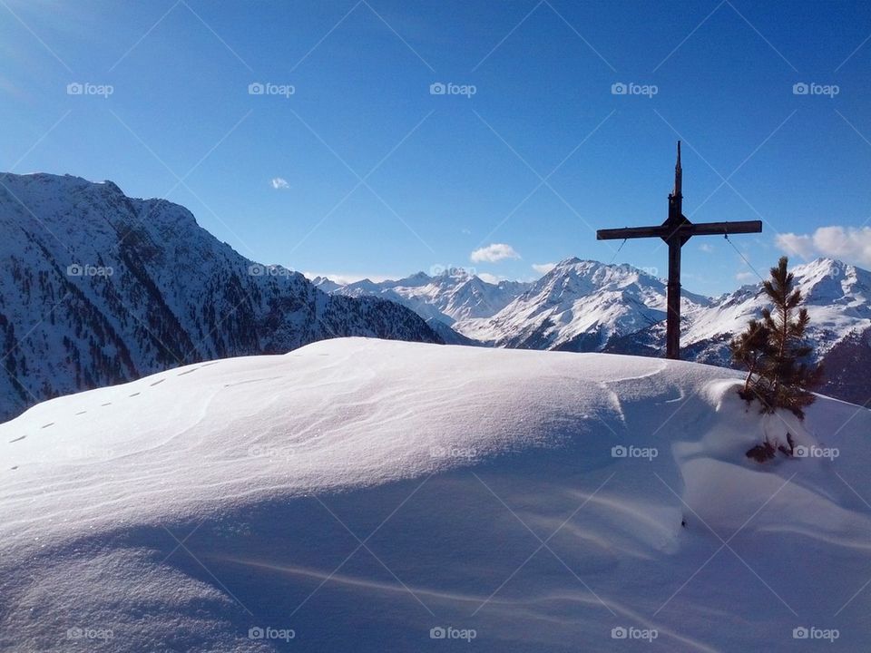 Mountain cross in snow