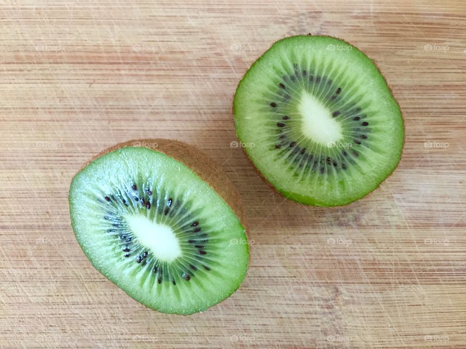 Kiwi fruit on bamboo board