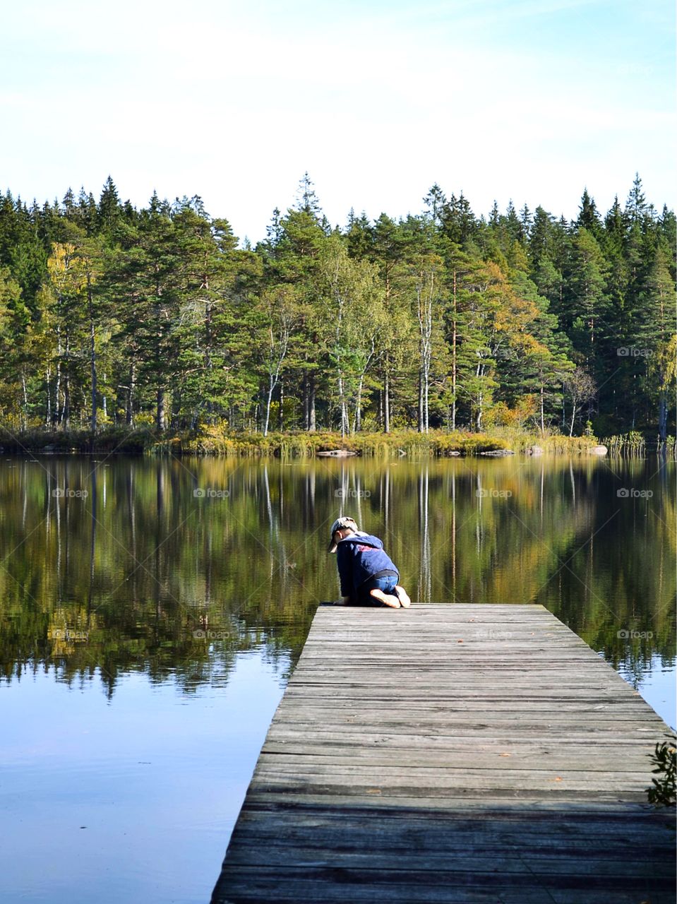 Boy looking in the water