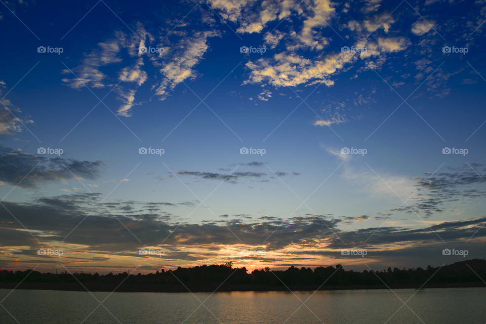 Sunset light against blue sky