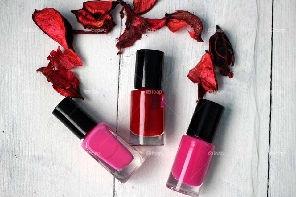 Beauty, health, spa and personal care: nail polish, flowers, rose petals