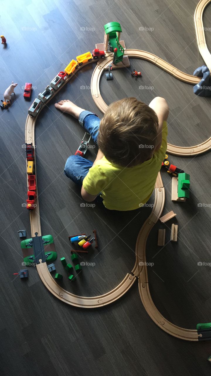 Boy playing with brio