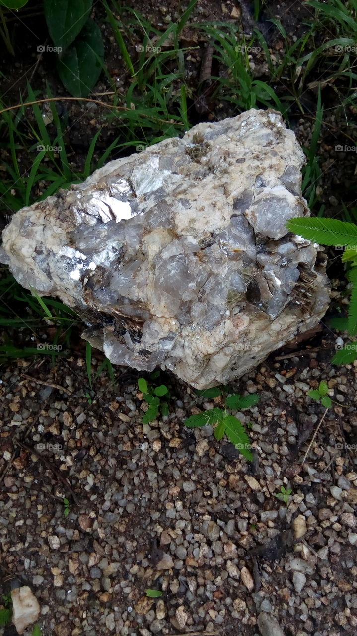 pegmatites with feldspar, mica and quartz with other minerals