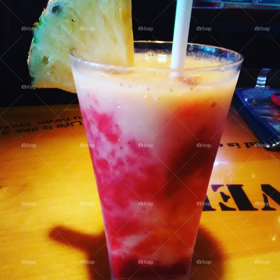 A delicious tropical fruity alcoholic cocktail at Bubba Gumps restaurant in time's square New York
