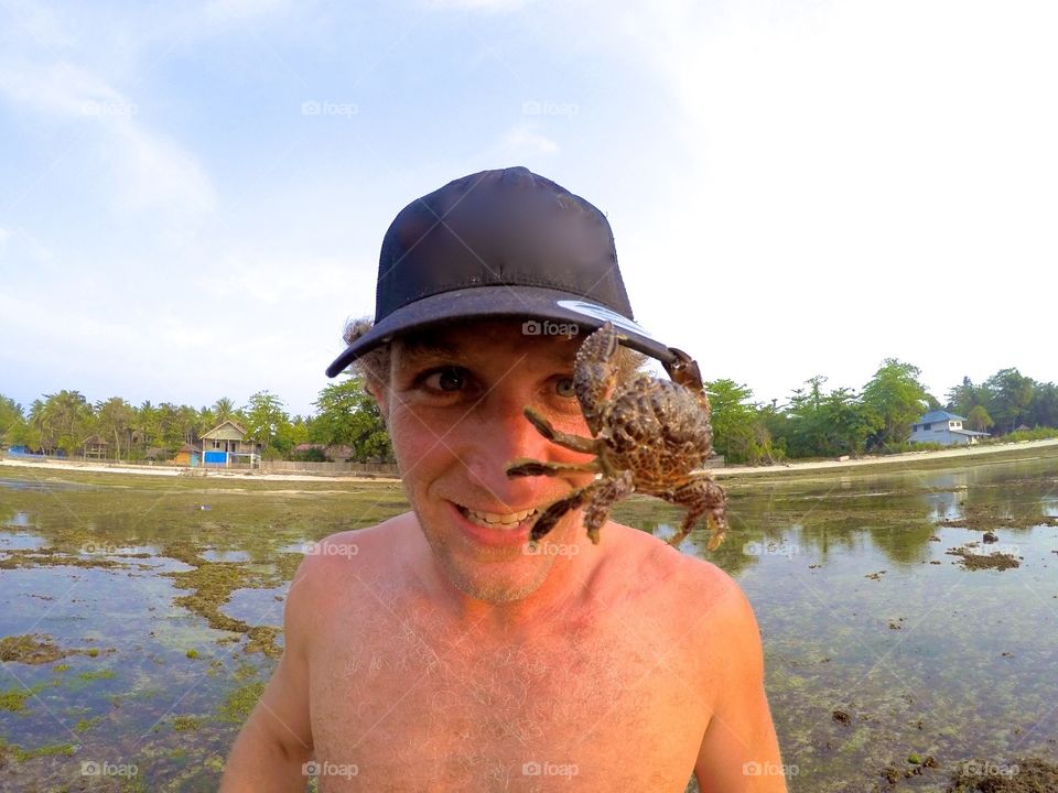 Crab on mans hat