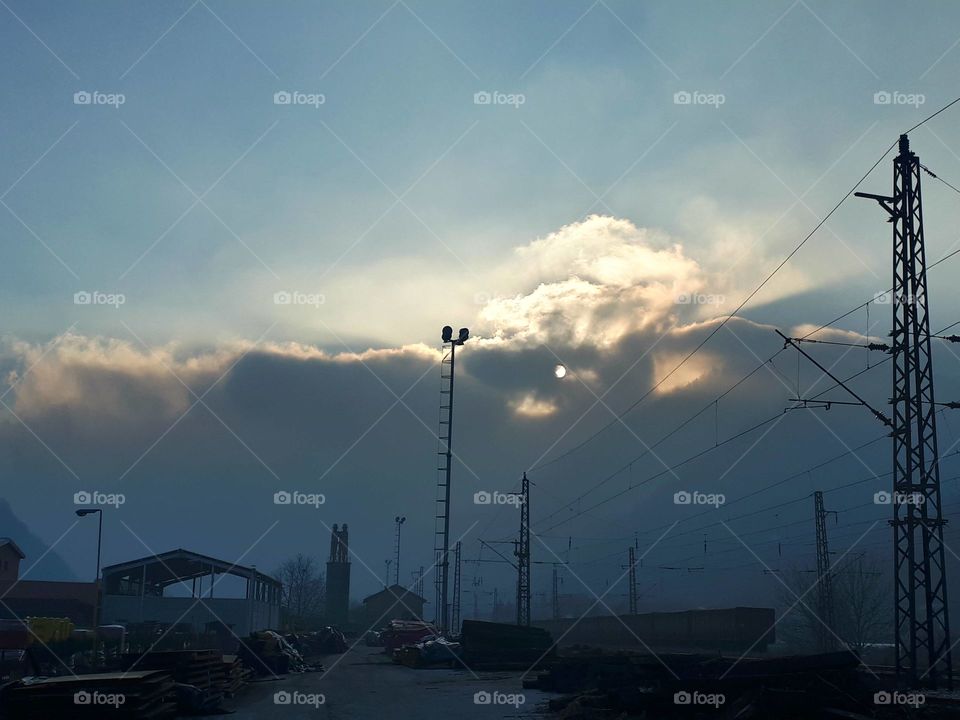 fog on the hill hides the sun and everything looks like an eclipse