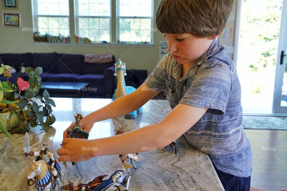 Young Boy Playing With Toys