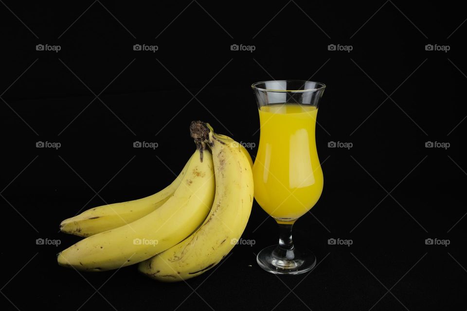 Banana and yellow juice glass.