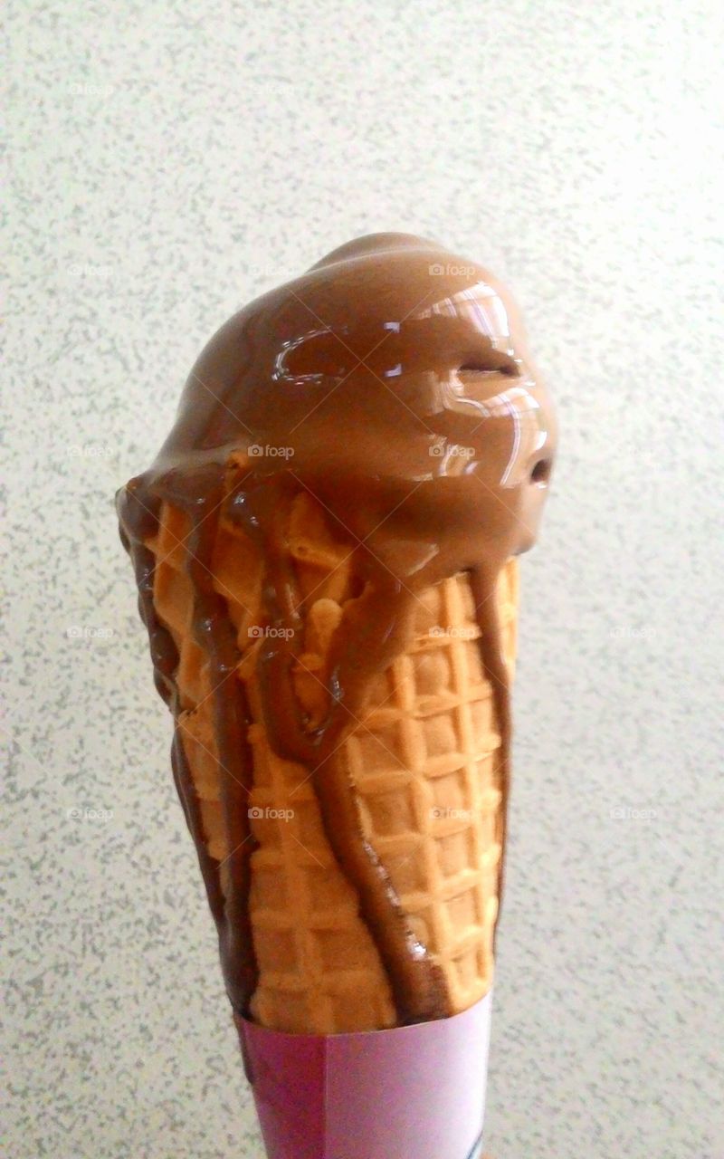 Melting Chocolate Ice Cream in Sugar Cone