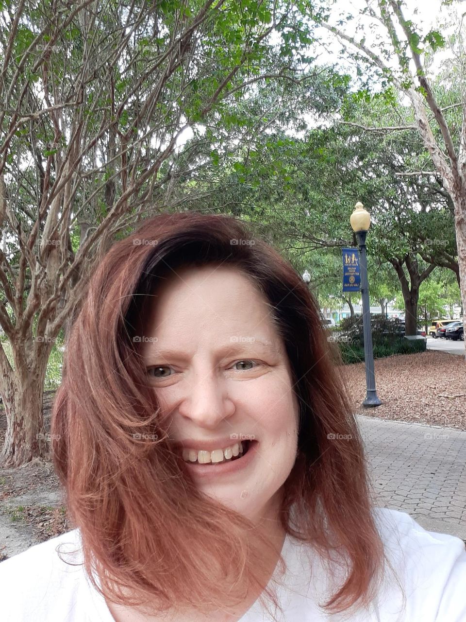 One of my favorite parks to go to is Lake Lily Park in Maitland, Florida. I took this selfie there on a windy day.