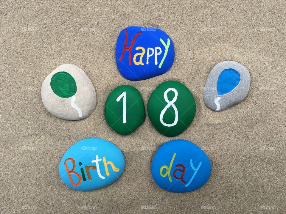 Happy 18 Birthday on colored stones 
