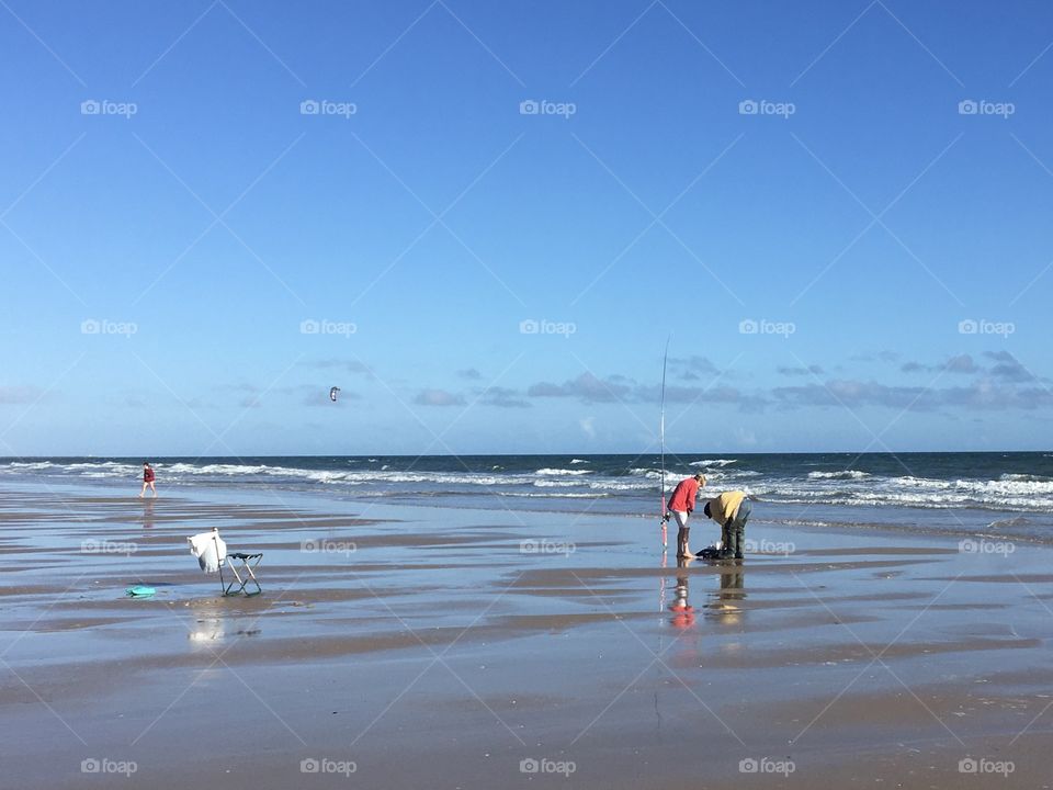 Looking for shells on beach