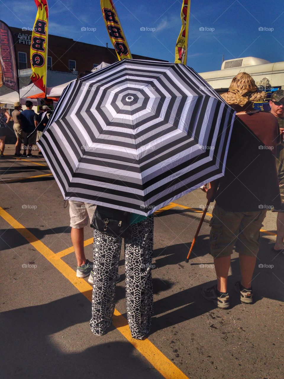 Summer day. Woman with umbrella on a sunny day