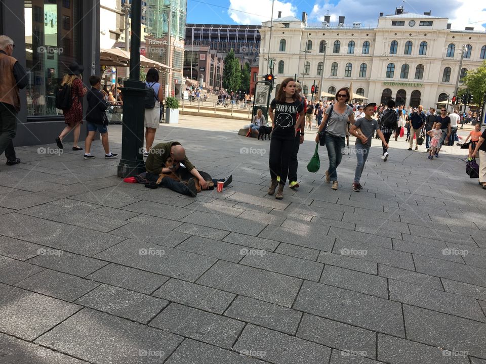 Touch full moment. Homeless man hugging his friend dog. 