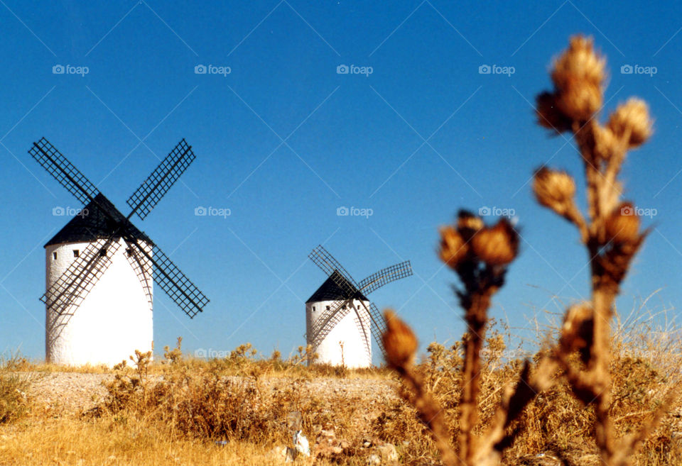 Old windmills in field