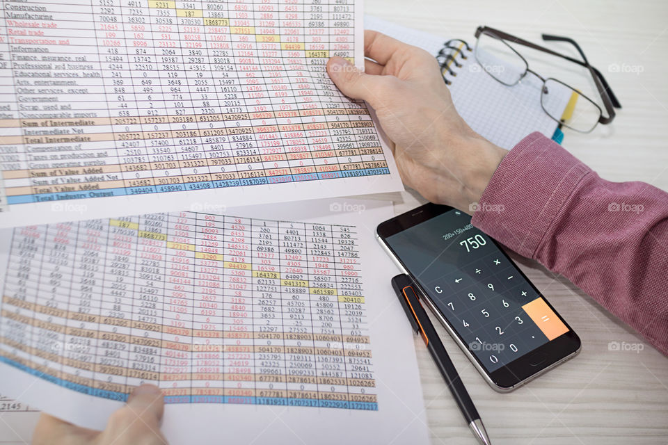 Close-up of a businessman calculating finance